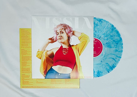 VISSIA With Pleasure Limited Edition blue splatter vinyl; the cover is a medium shot photo of a pink-haired woman on a white background; she is wearing silver hoop earrings, shiny blue disco pants, a fuschia halter top, and bright yellow light blazer